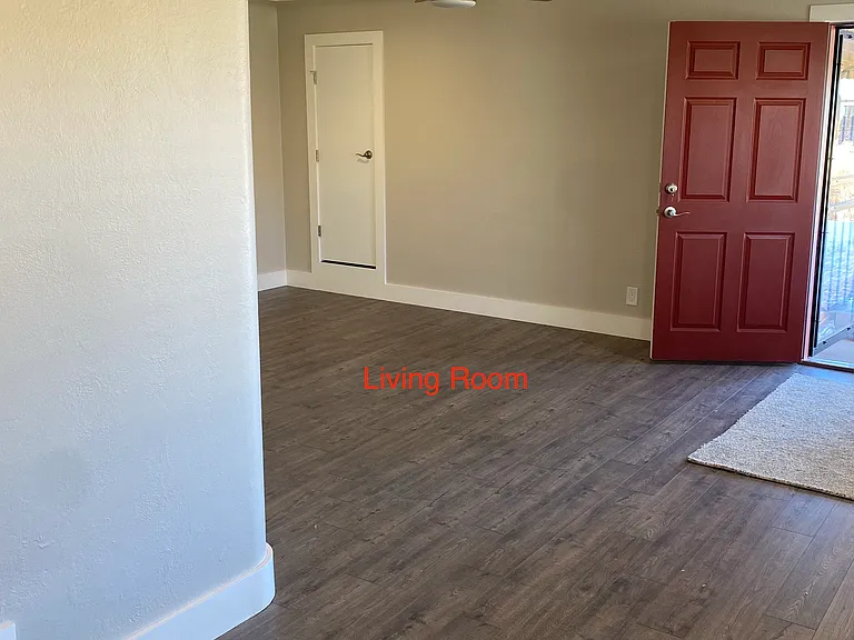 Looking towards the front door and living room from the dining area.