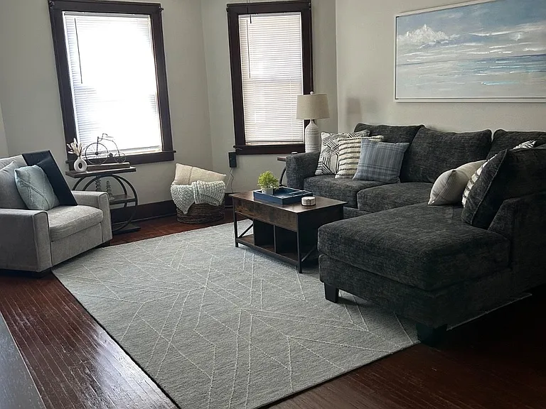 Large living room that is perfect for relaxing after long days with plenty of natural light if you also work from home.