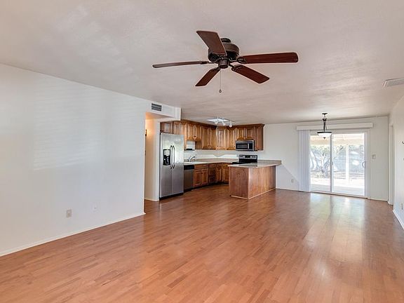 Open floor plan with breakfast bar and eat-in kitchen.