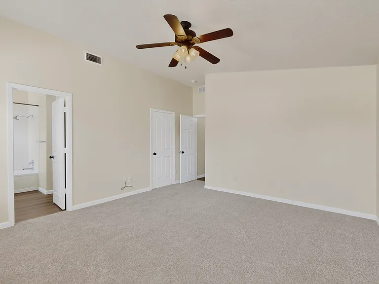 The extra large primary bedroom creates a stunning private retreat after a long day with two large windows and beautiful views of the back yard space.