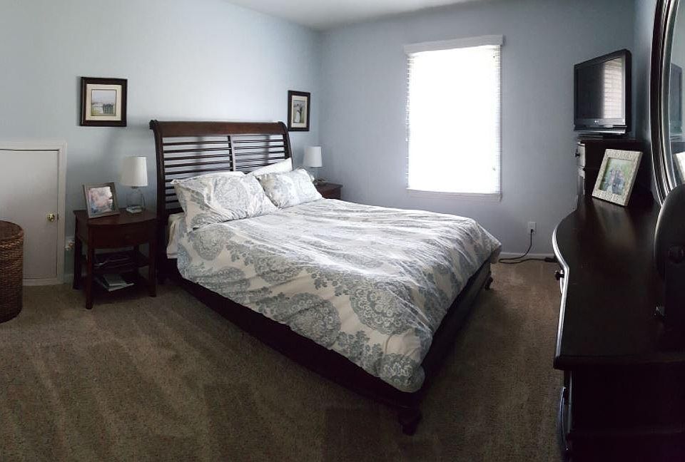 Master Bedroom. That little door? Opens to large storage area above 1.5 stall garage! Garages in this neighborhood are a rare find.