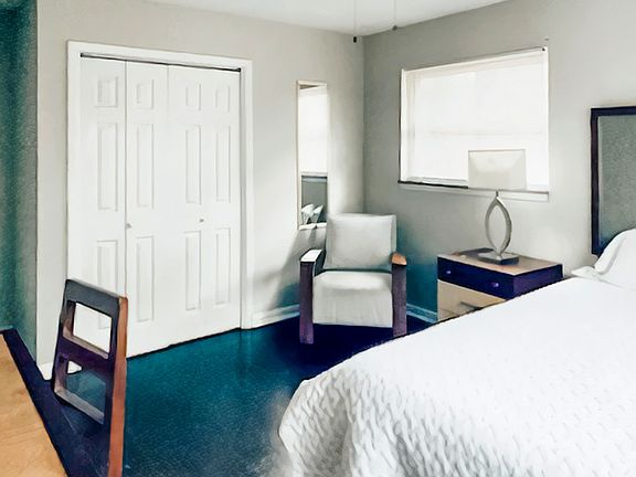 This room also has a large closet and a full-length mirror.