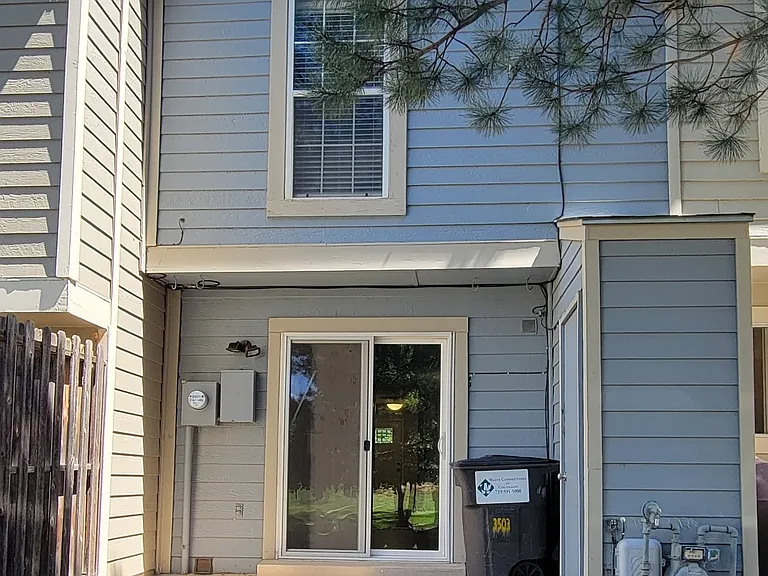 Back side patio and storage shed on the right. Master bedroom on 2nd floor facing the courtyard.