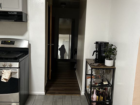 Step through the kitchen into a quiet hallway that connects to three restful bedrooms