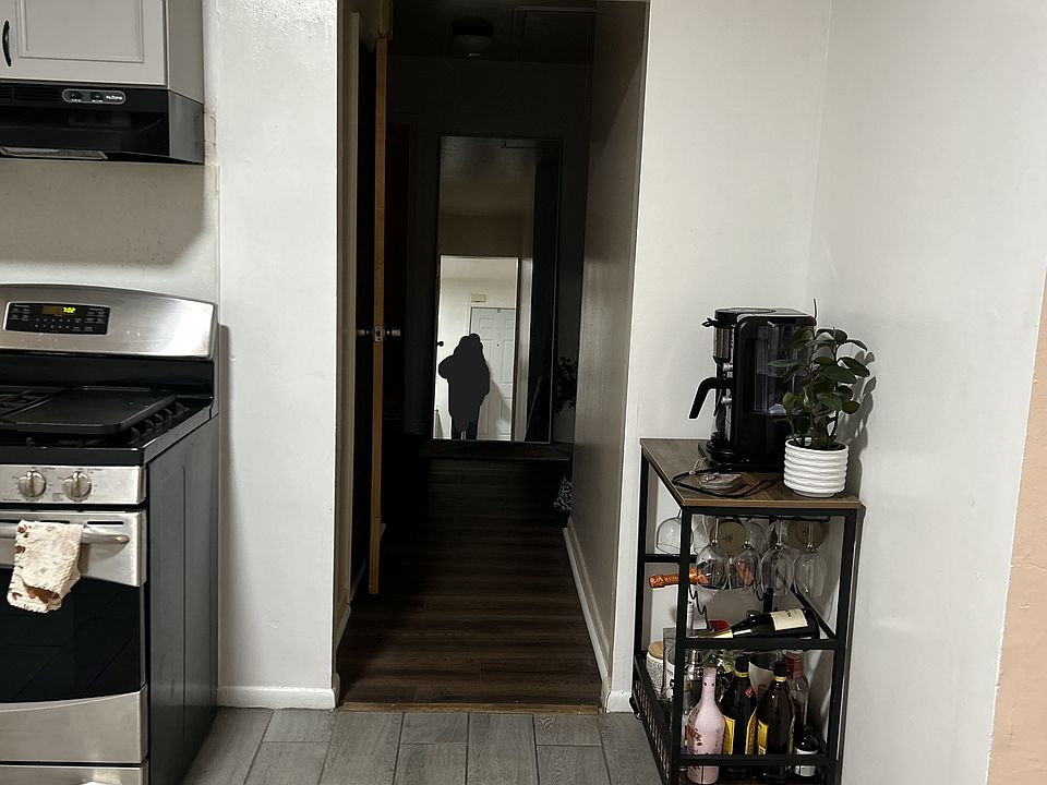 Step through the kitchen into a quiet hallway that connects to three restful bedrooms