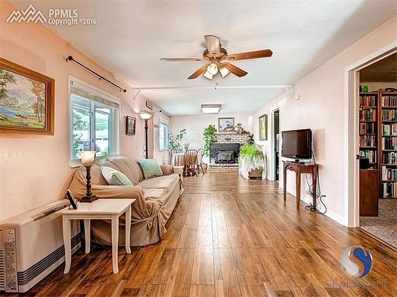 Open concept from the kitchen to the entry way/ wood stove