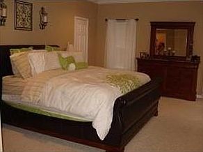 Master bedroom is large, has a walk in closet .