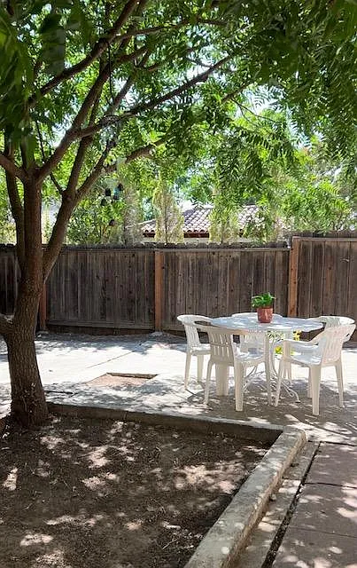 Pretty sitting area in shady shared backyard