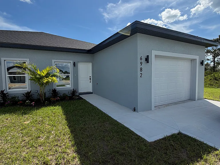 Private driveway, entry and garage (side B)