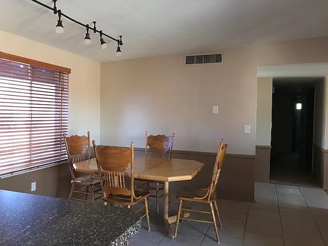 Dining room with sweeping view of the Catalina range from thimbel top to Pusch ridge.