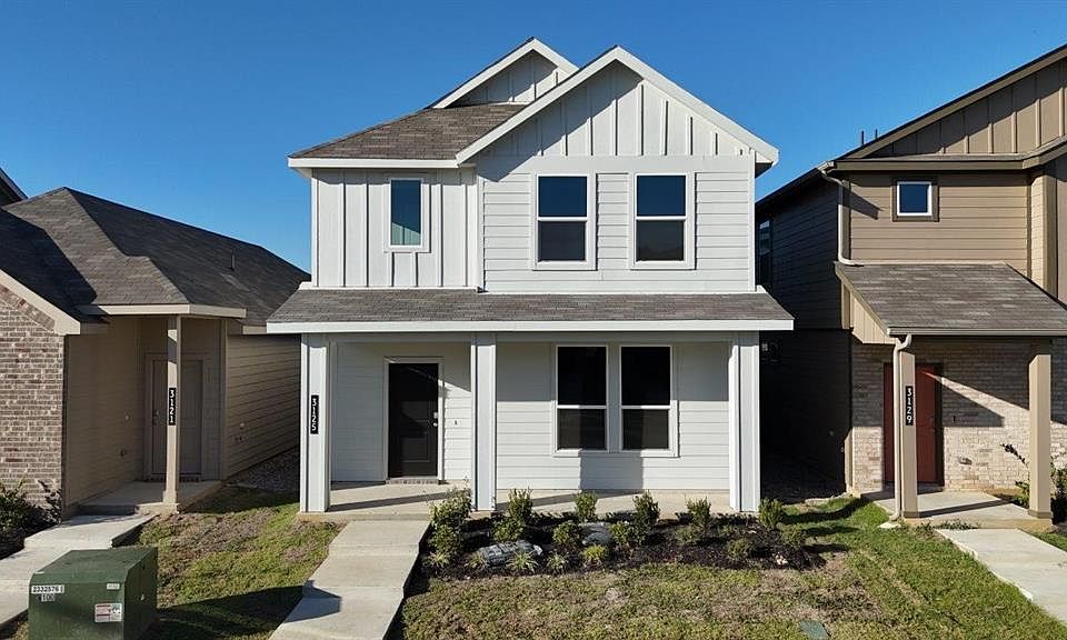 Front Elevation - D.R. Horton''s WalnutFloorplan Elevation B - All Home and community information, including pricing, included features, terms, availability and amenities, are subject to change at any time without notice or obligation. All Drawings, pictures, photographs, video, square footages, floor plans, elevations, features, colors and sizes are approximate for illustration purposes only and will vary from the homes as built.