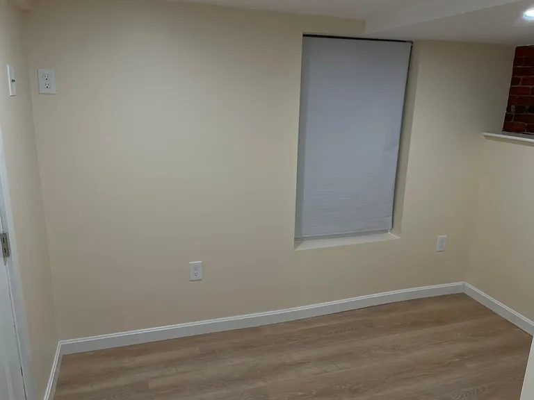 A full window in the bedroom and to its left are hook ups for your wall mounted tv.