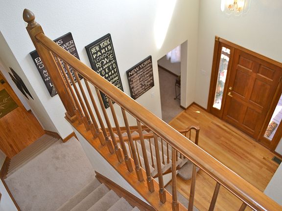 Bright two-story entry with split staircase.