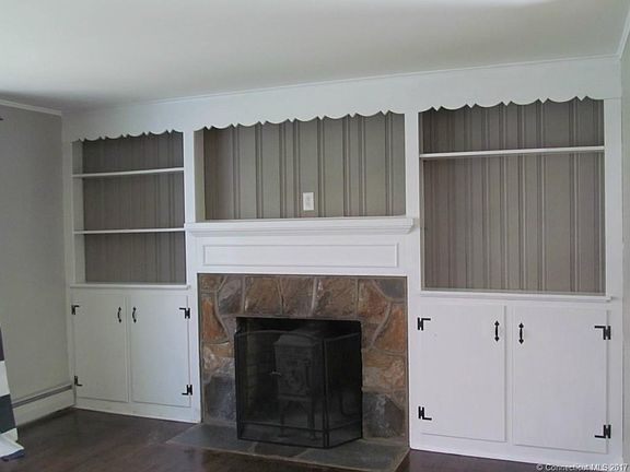 Built in bookcase and fireplace.