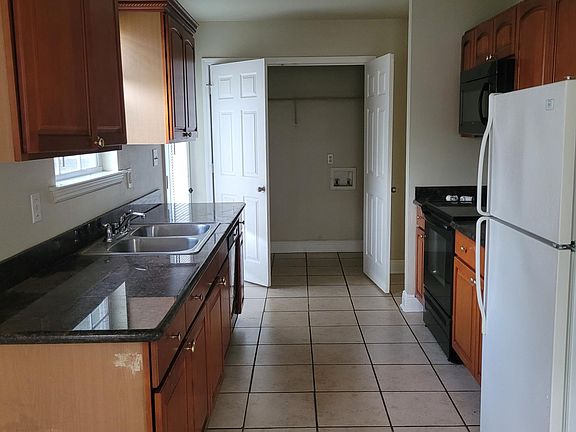 Kitchen, side door and laundry room to the back