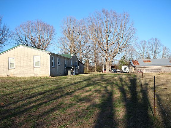 Back of home with barn