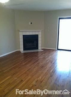 Living Room with Sliding Door to Balcony
						:
						Wired for TV above fireplace