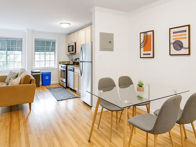 Bright, open-concept space with a modern kitchen, cozy living room, and a stylish dining area_perfect for entertaining or relaxing.