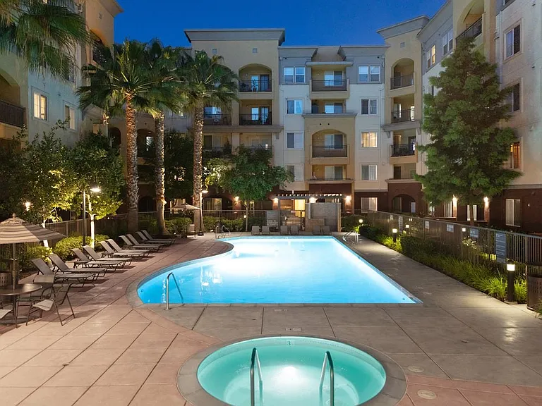 Spa and swimming pool with lounge seating