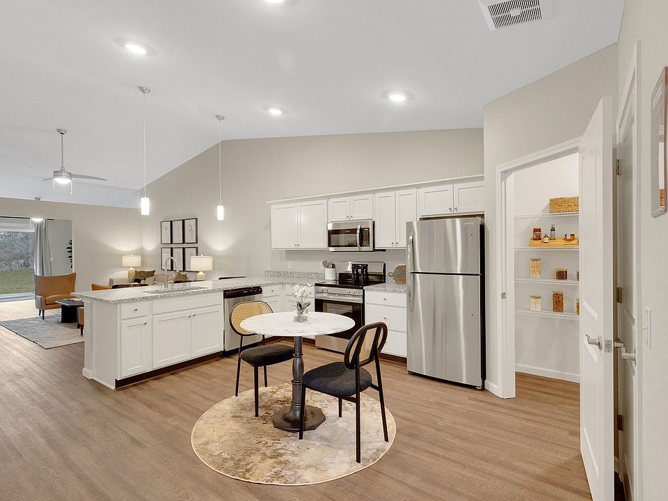 Granite Counters with Stainless Steel Fixtures and Appliances