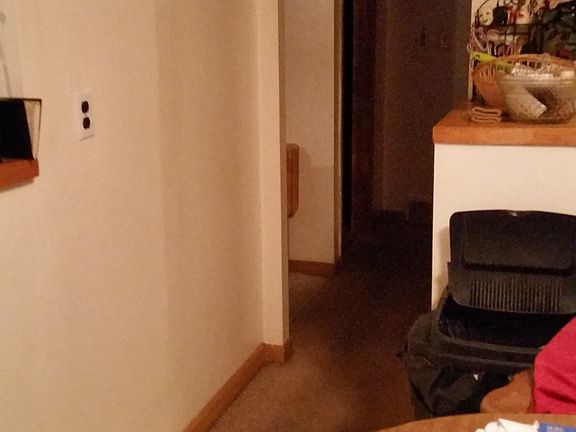 View from kitchen to hallway that leads to the shared bathro