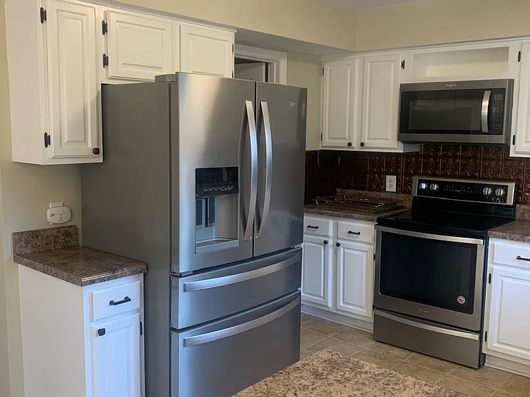 Updated cabinets and large countertop.