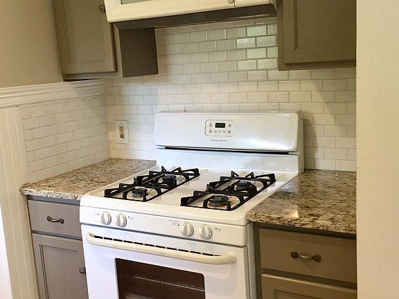 Gas stove with built-in microwave