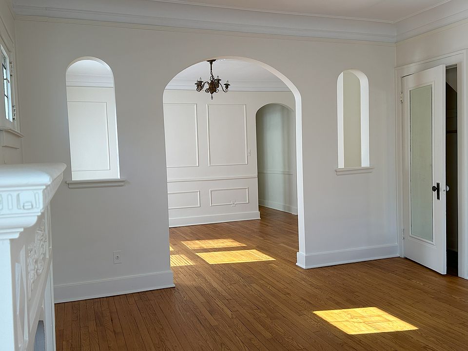 Living room to dining room with beautiful archways.