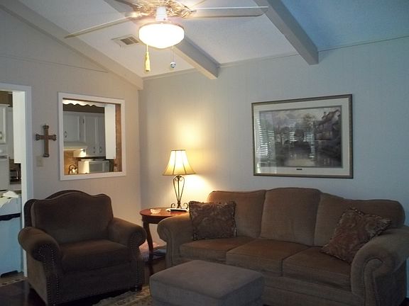 Den with vaulted ceiling