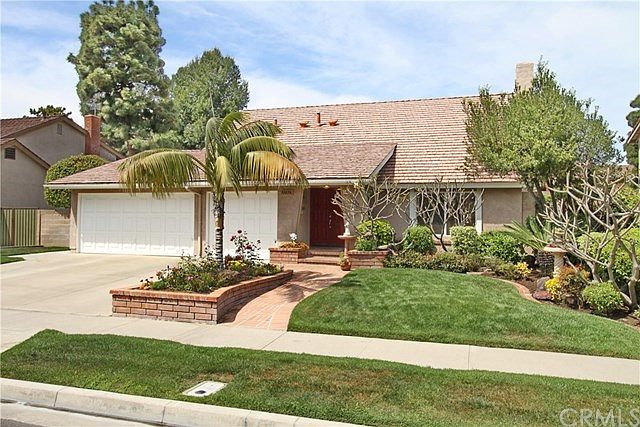 A gem located on a cul-de-sac facing south with daily breezes. Professionally Landscaped and Hardscaped with custom brick planters and pathways. The multiple Plumerias will soon be in full bloom bringing their rich fragrance with the breezes.