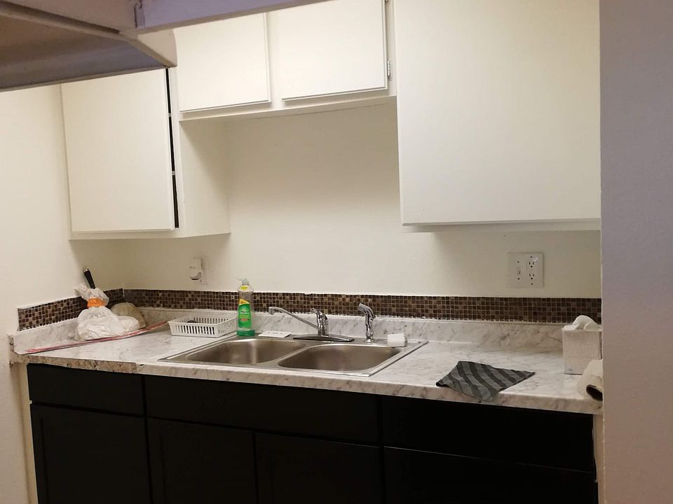 Two way sink with garbage disposal. Spacious cabinets space.