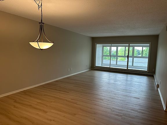 Another view of the porch. All uncarpeted areas have new LVP flooring. Carpeting is new as well.