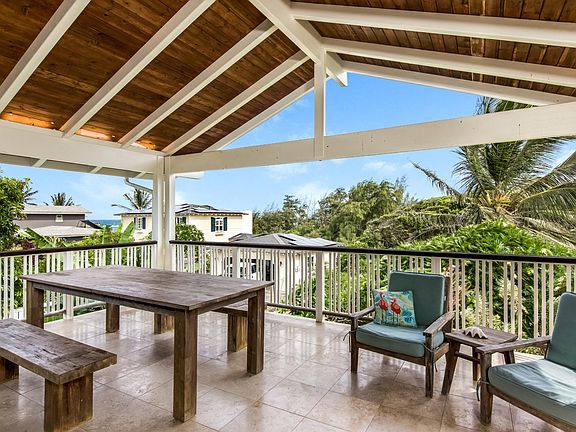 Stunning deck with peek-a-boo beach views.