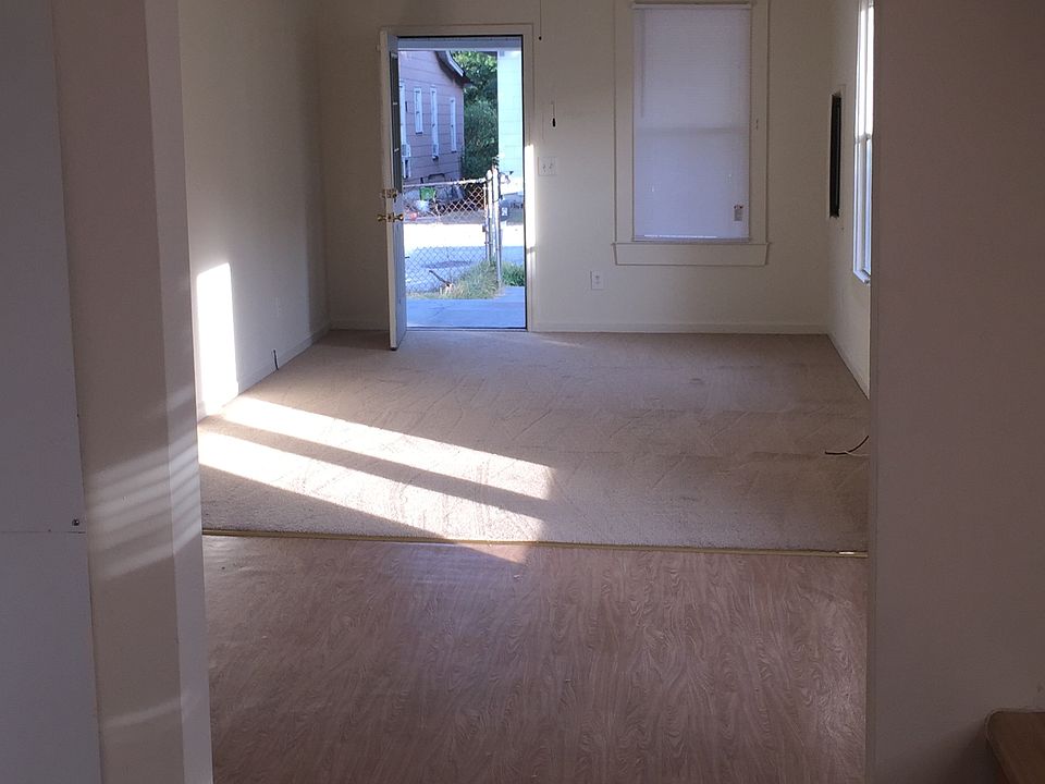 Looking from kitchen through dining area and living room tow