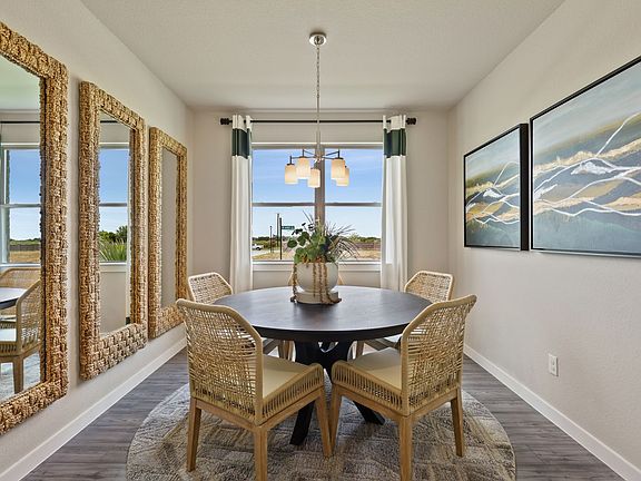 Dining room in the Topaz home plan by Trophy Signature Homes - REPRESENTATIVE PHOTO