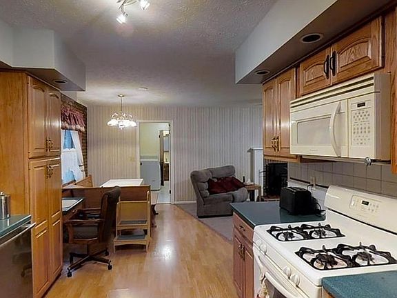 Eat in kitchen area open to the living room offers opportunity for family and guests to hang out with the chef of the house.