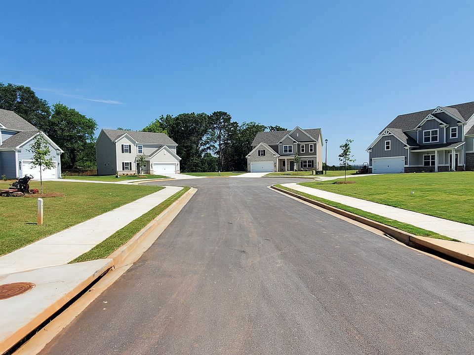 Southwind exterior: two-story homes with private driveways and attached garages on a cul-de-sac.