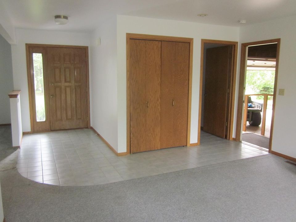 Front entryway, entrance to garage, coat closet and second f