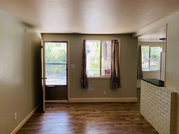 Other side of the living room, with the kitchen off to the right.