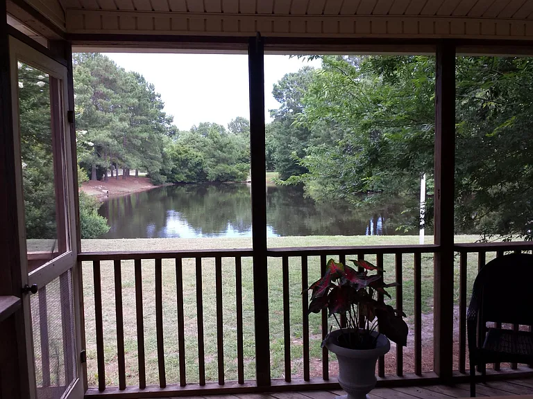 Screen porch for relaxing and enjoying nature.