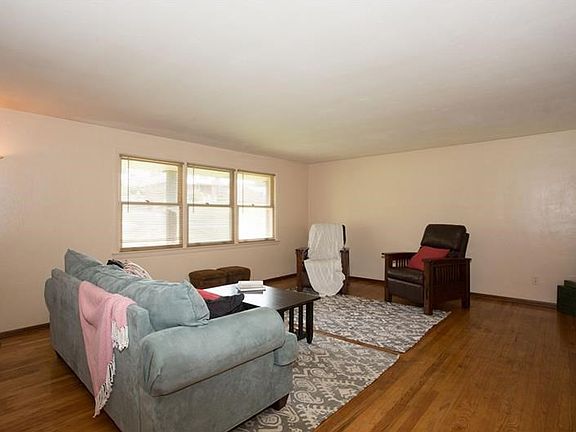 Freshly buffed hardwood floors and neutral colors throughout bring continuity to the main level.