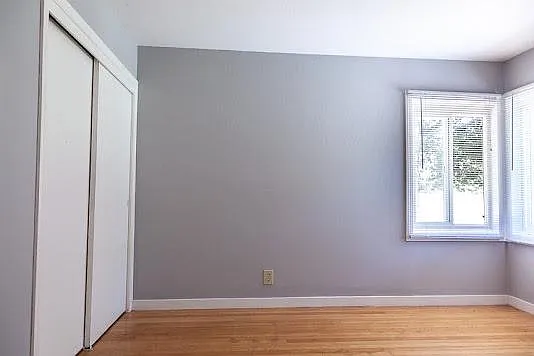 Bed room located in back of house, shows closet
