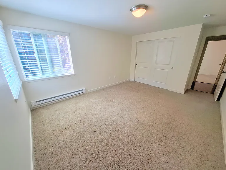 Bright, spacious master bedroom with large closet.