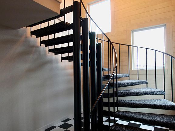 First floor entry hall wtih spiral staircase.