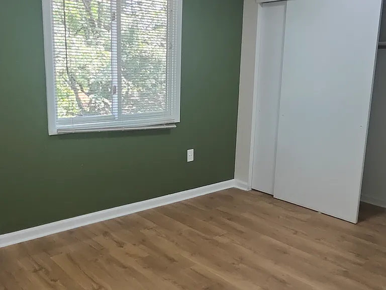 Kids room with ceiling fan and recessed lights