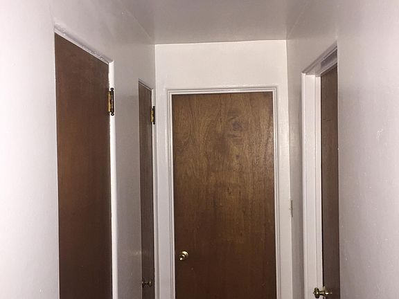 Hall to bathroom, bedroom and storage closet
