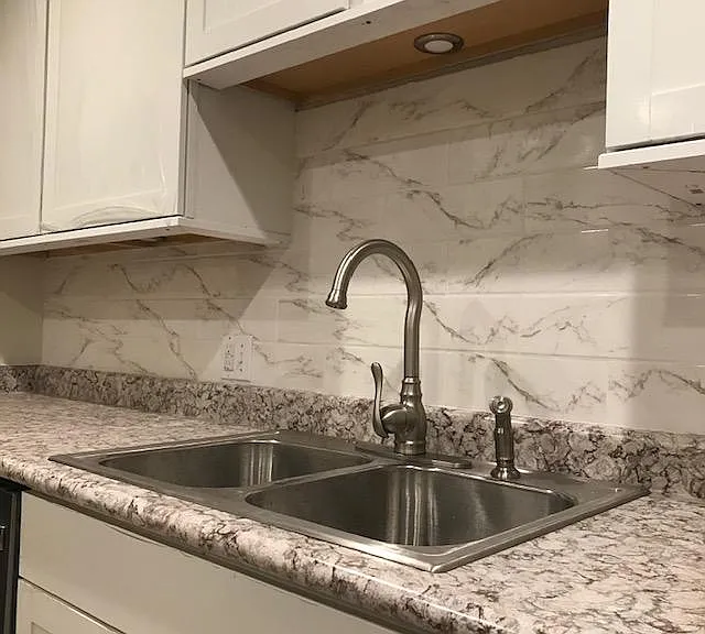 Close up of countertops and backsplash. Lovelier in person