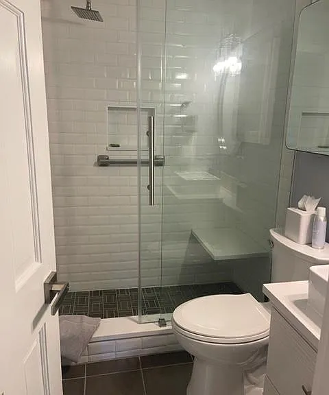 Large medicine cabinet above the toilet for ample storage.