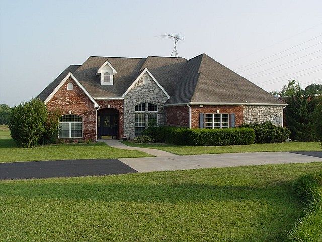 Elegant exterior with brick and stone
