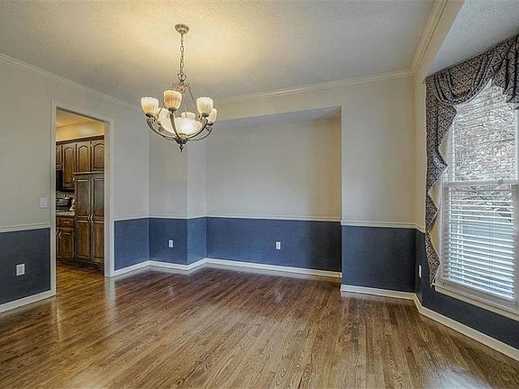 Look at those beautiful floors! Spacious formal dining.